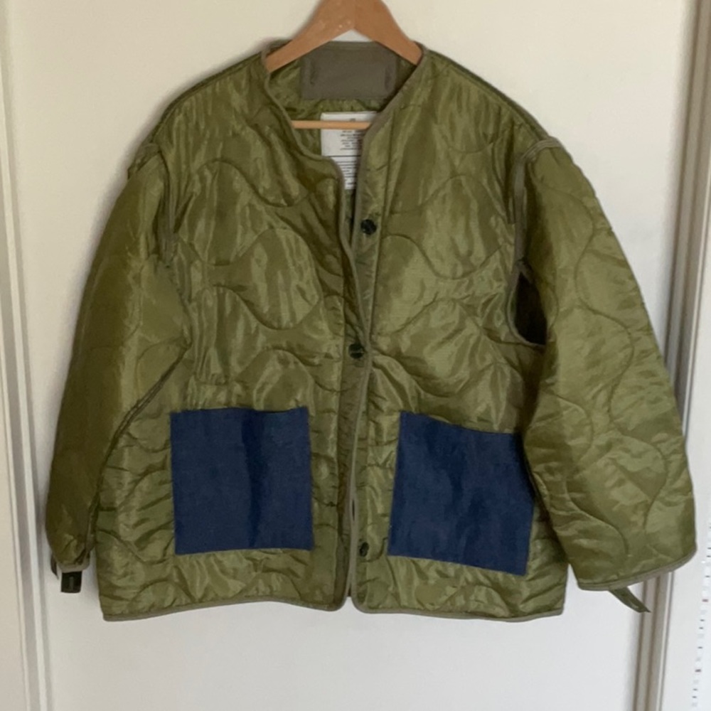 Women’s military liner with buttons and denim pockets. Size large fits like M